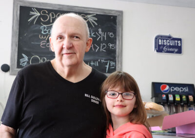 Bill Sullivan and girl at Sullivans Diner in Hudson Falls