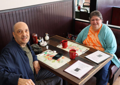 Smiling family couple dining breakfast at Sullivans Diner in Hudson Falls